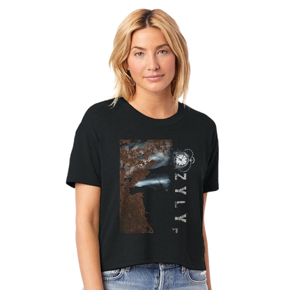 Woman wearing a black t-shirt with a tree graphic design with ''OZYLY'' and clock watch